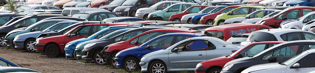 Row of multi colored cars in a lot