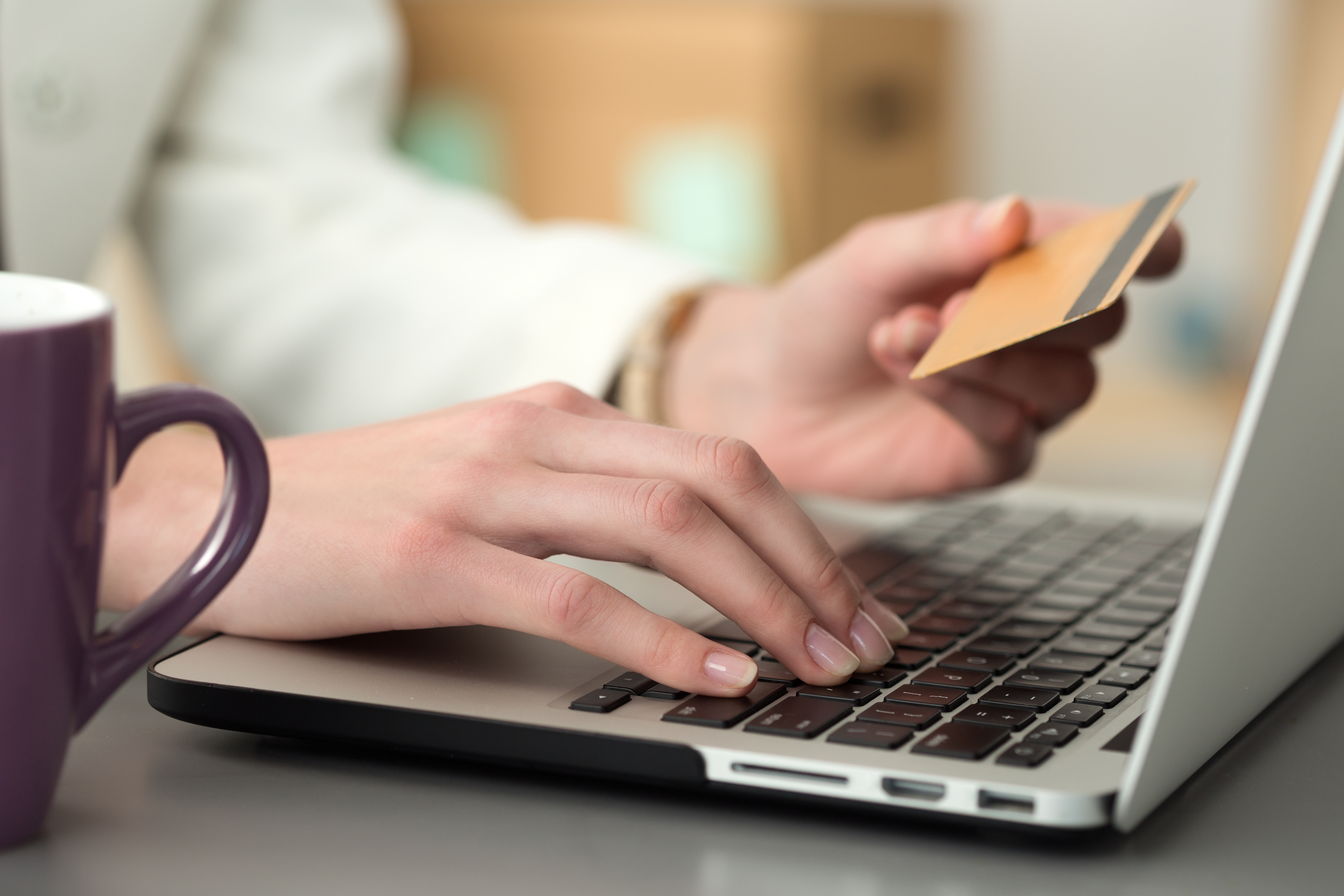 Close up view of businesswoman hands holding credit card making a purchase