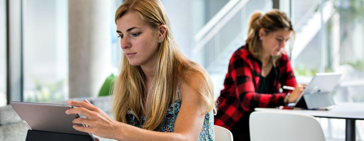 Lynn students working on tablets in a room