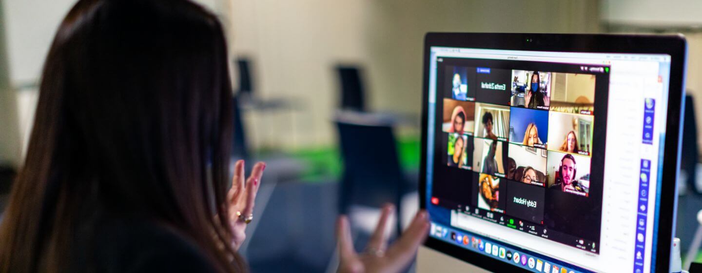 close-up of student looking at a computer screen during a web meeting