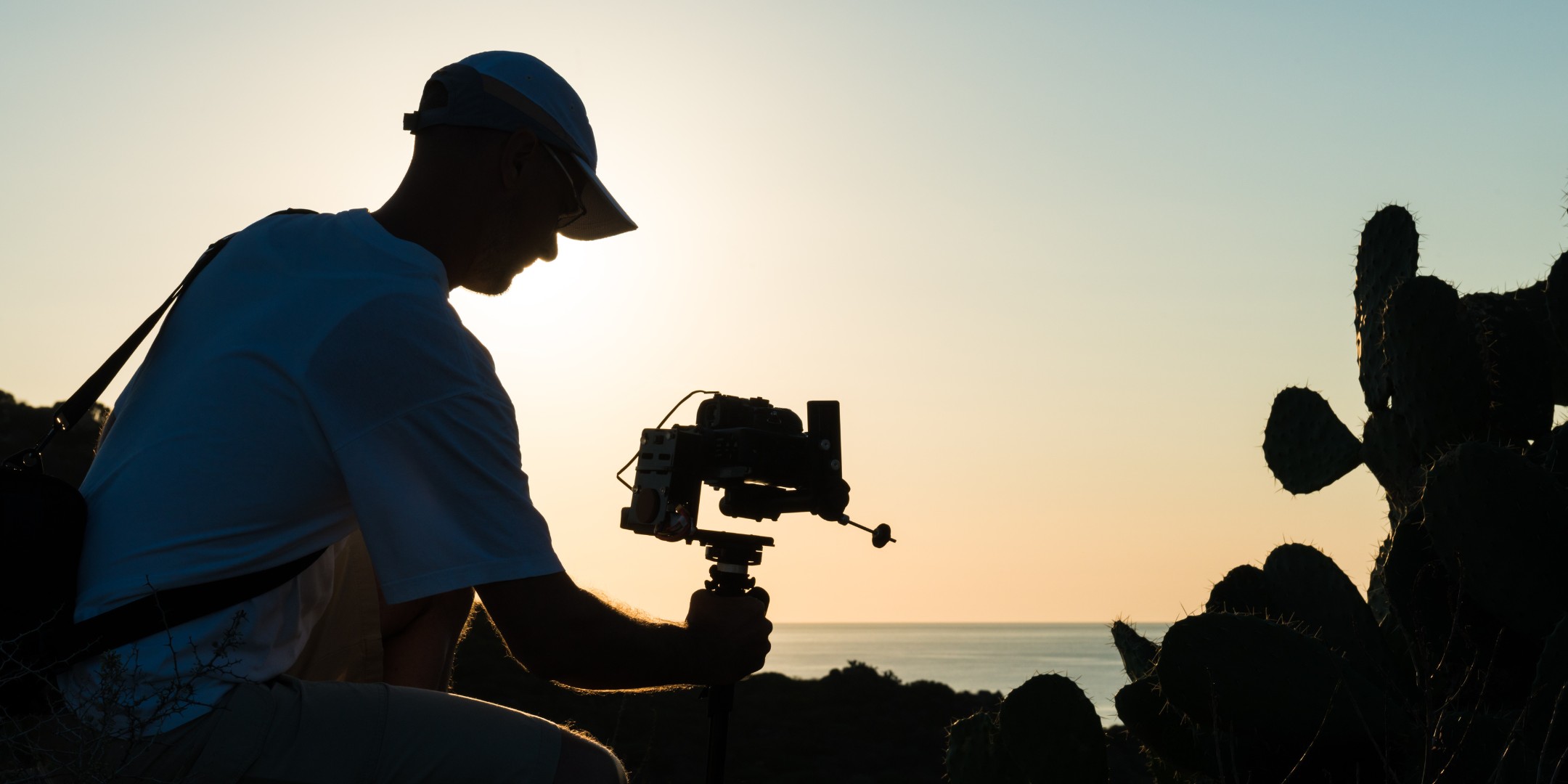 Man filming at dawn with camera on rig