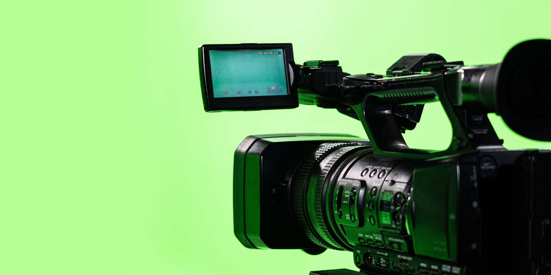 TV camera in professional chroma studio, green screen backdrop