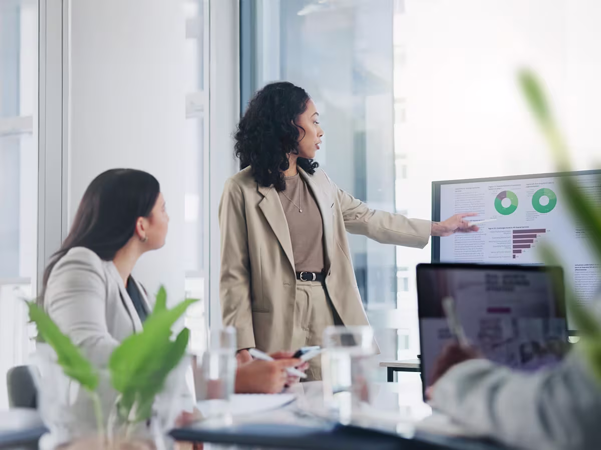 woman presenting to the team