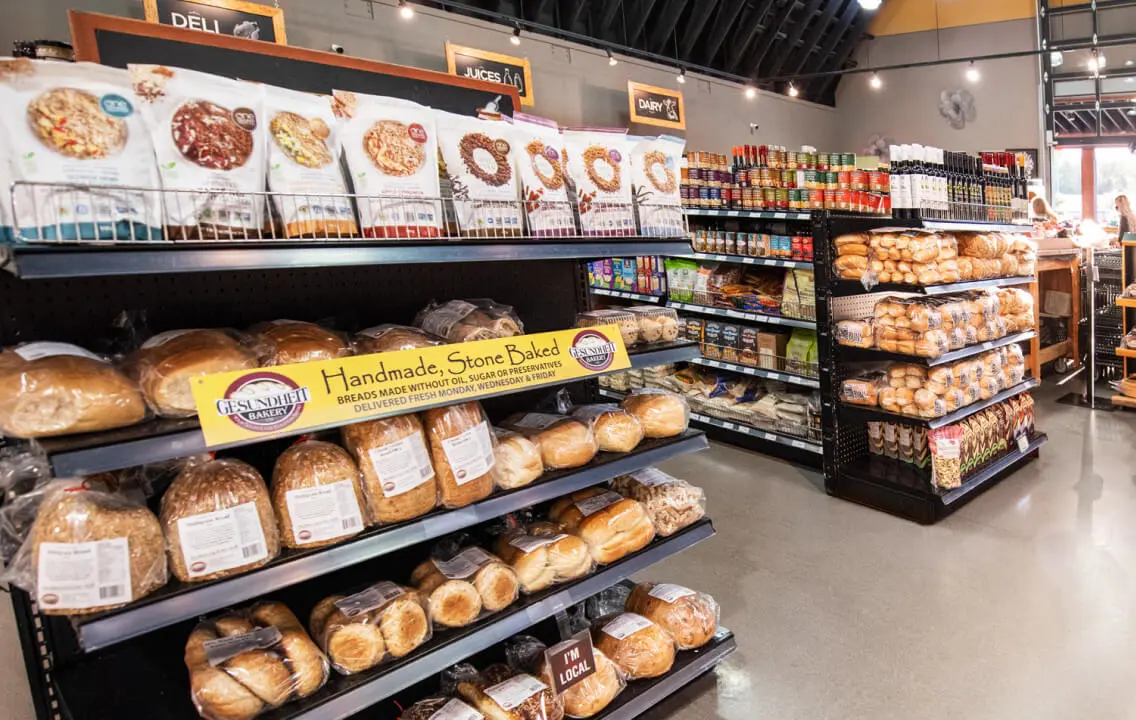 A bakery with a variety of breads on display.