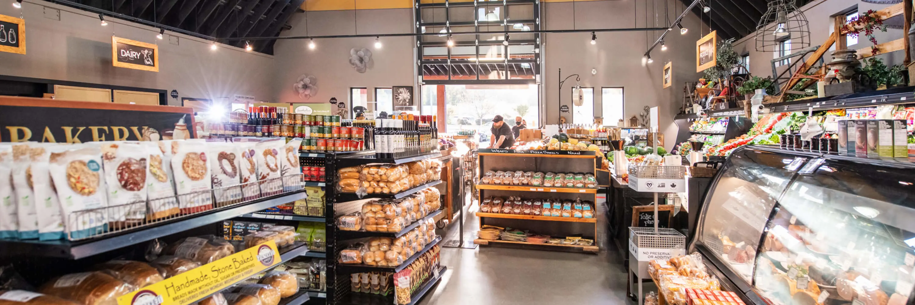 The inside of a grocery store with a lot of food.