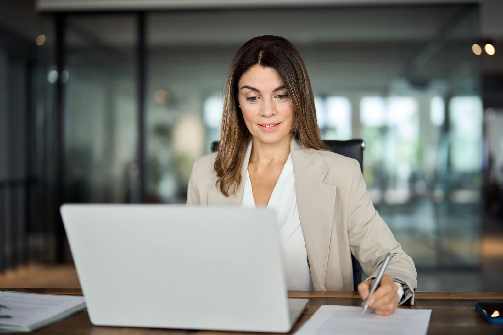 A woman focused on her work related to Trade Promotion Management S4 Upgrade.

