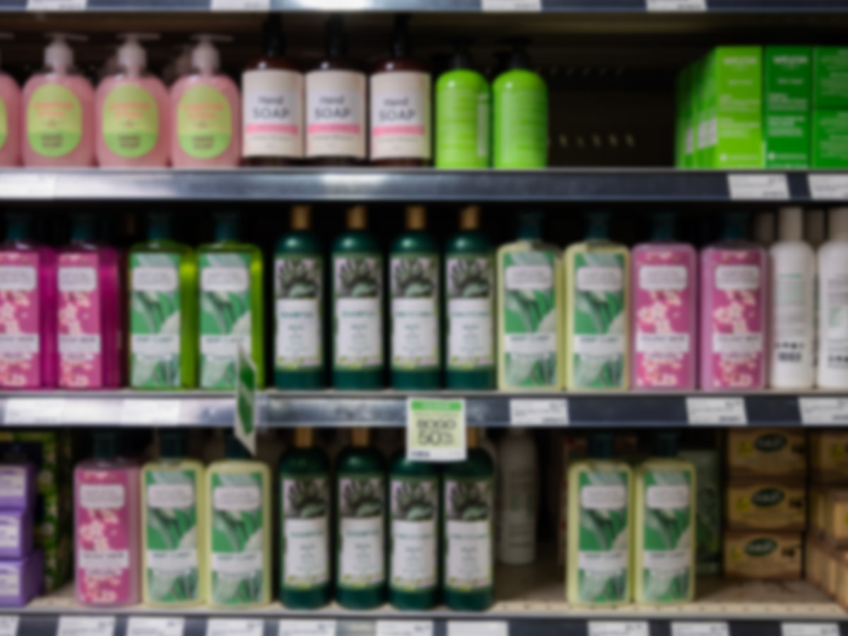 Bottles of shampoo displayed on a retail shelf, showcasing product placement for software image recognition analysis