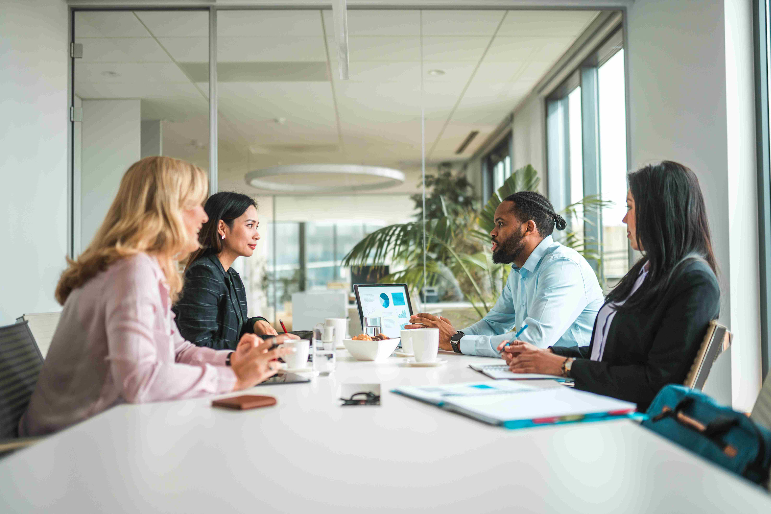 CPG professionals discussing TPM software implementation 

