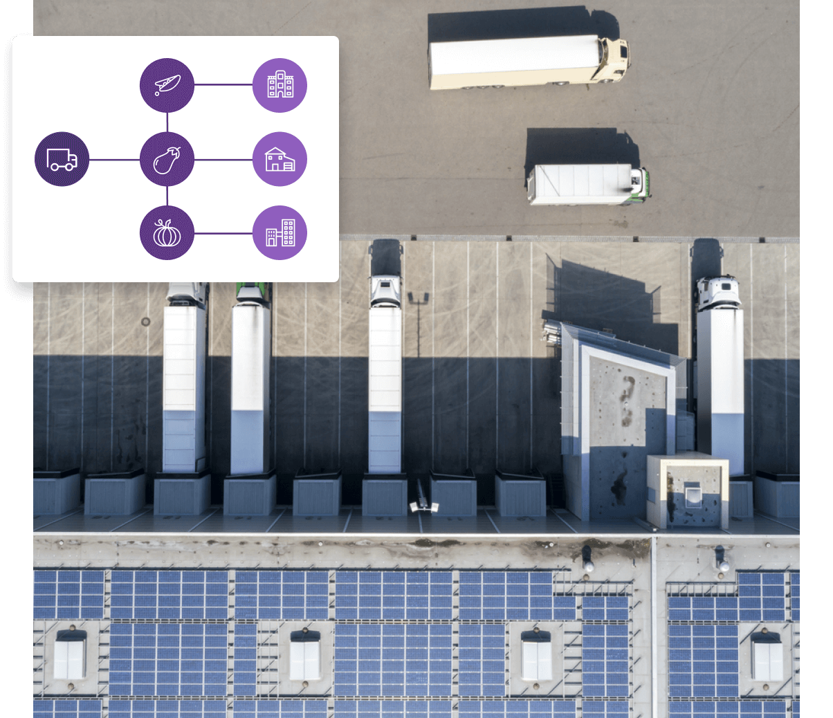 An aerial view of a solar farm with trucks and solar panels.