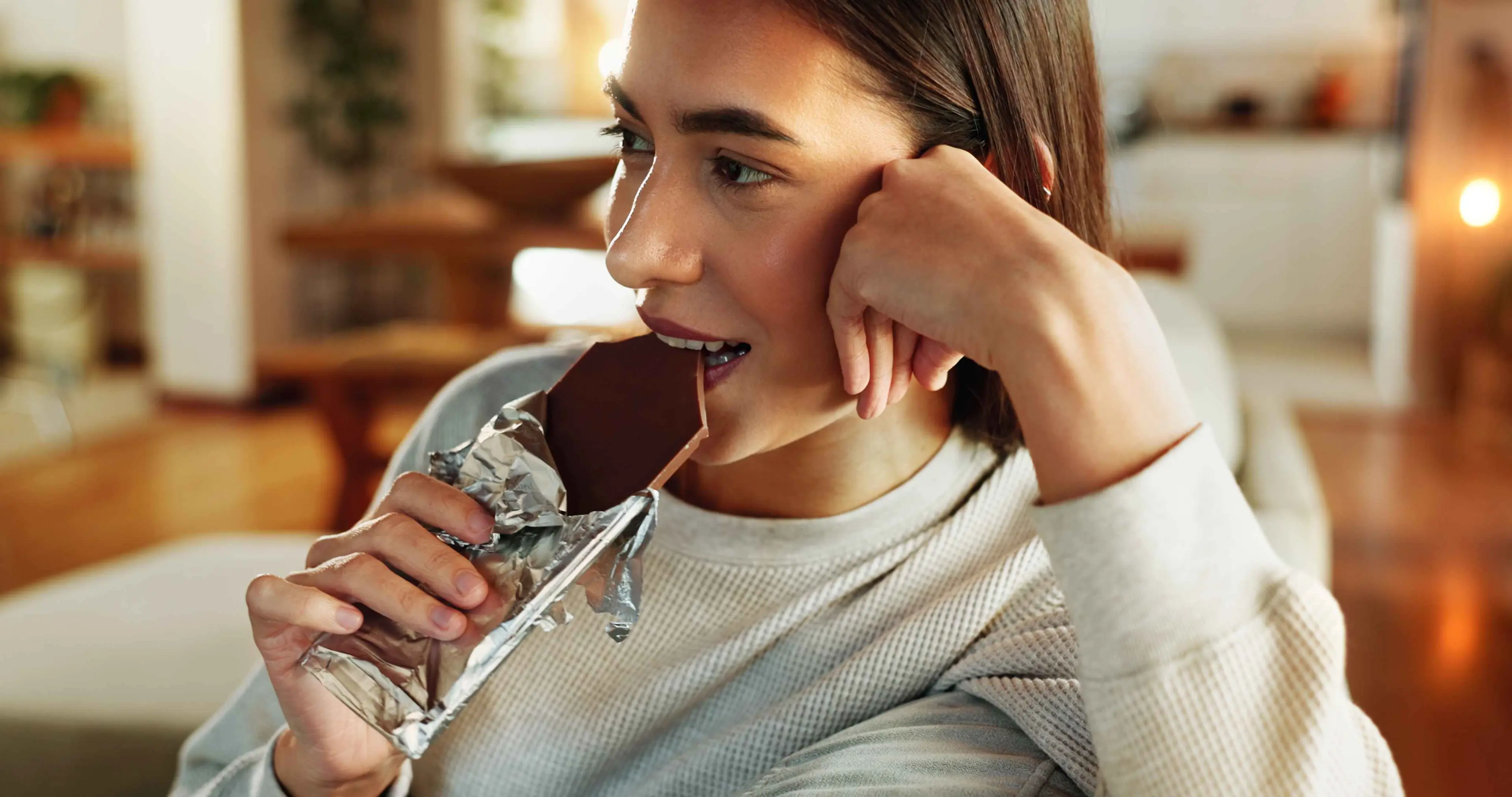 Woman eating Lindt Chocolate.

