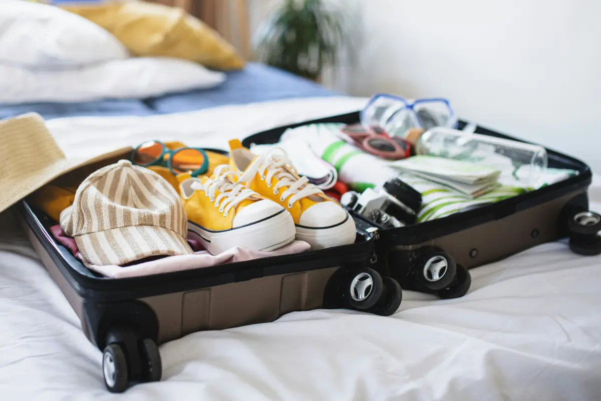 An open suitcase with an assortment of items