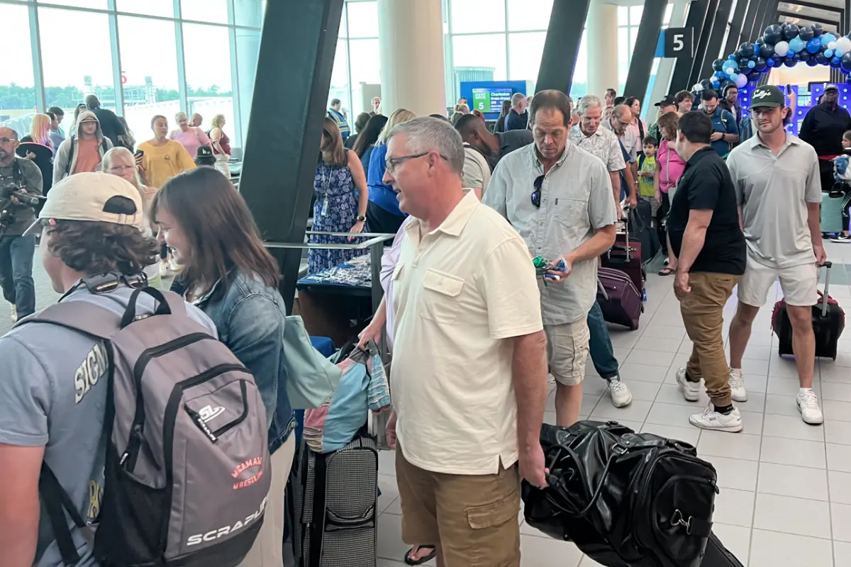 Travelers lined up in an airport