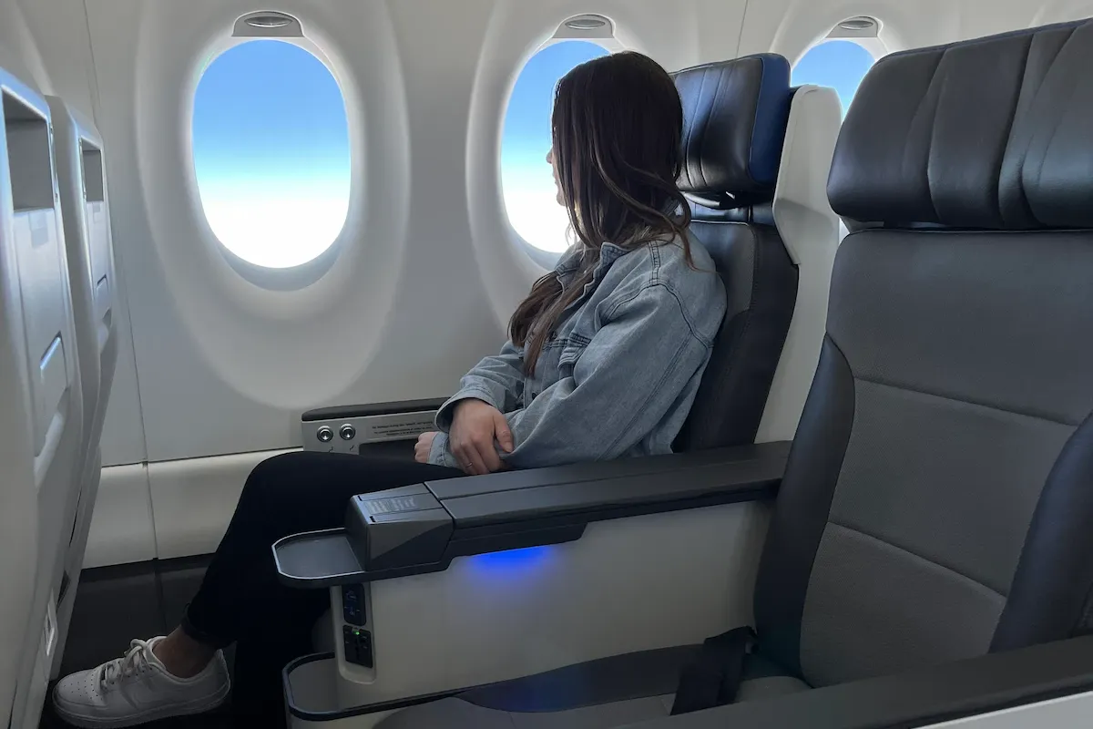 A person sitting in the Breeze Ascent seat looking out the window