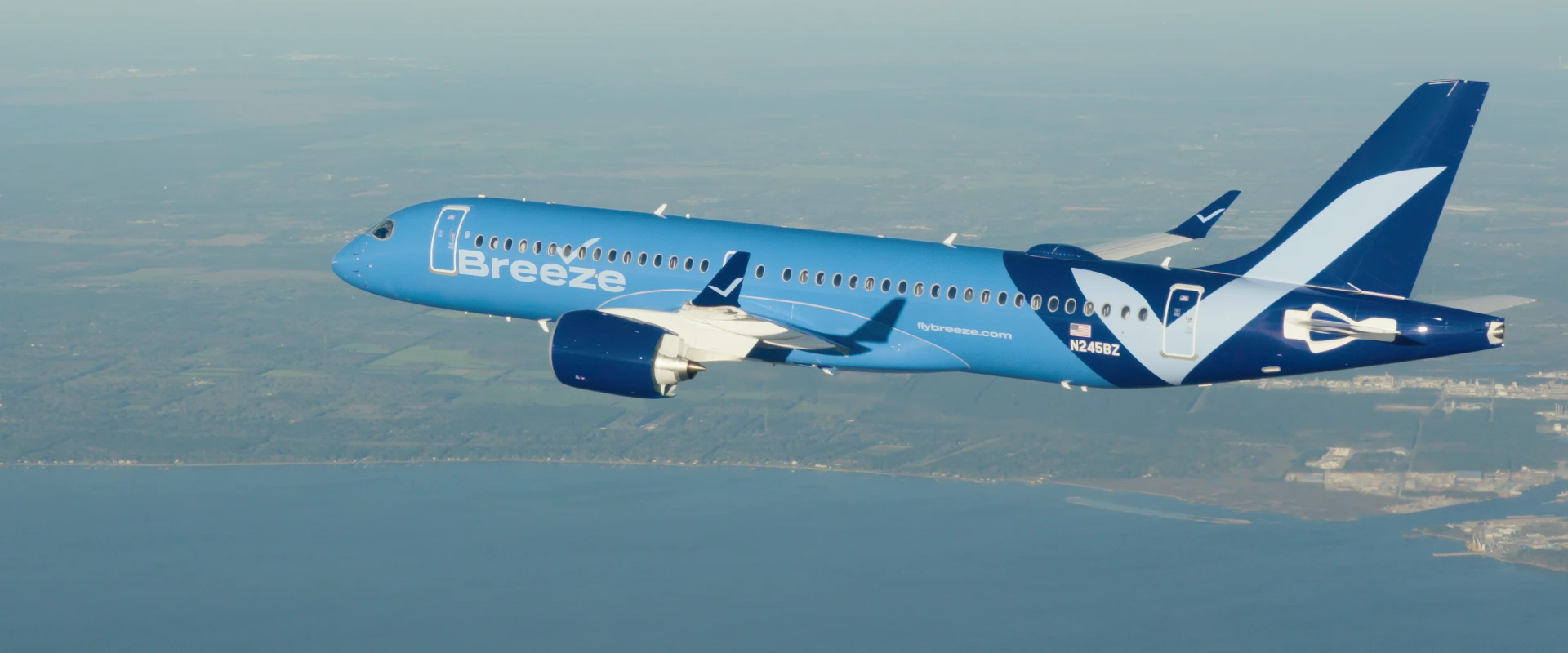 A Breeze Airways Airbus A220 in flight