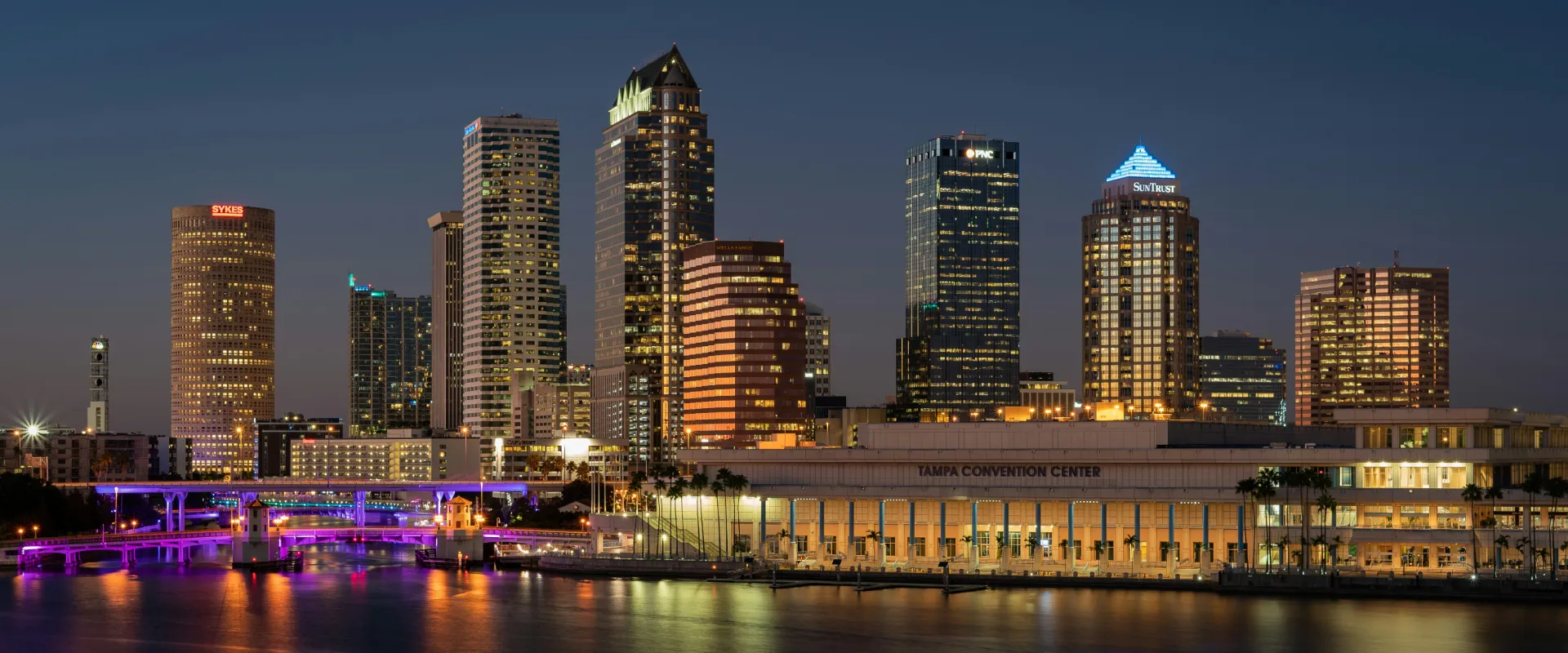 Downtown Tampa skyline at sunset reflecting on the water