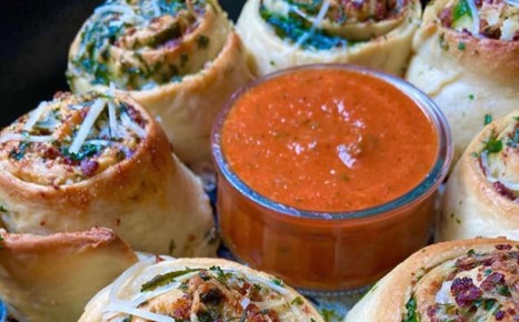 Savory rolls with an orange dipping sauce