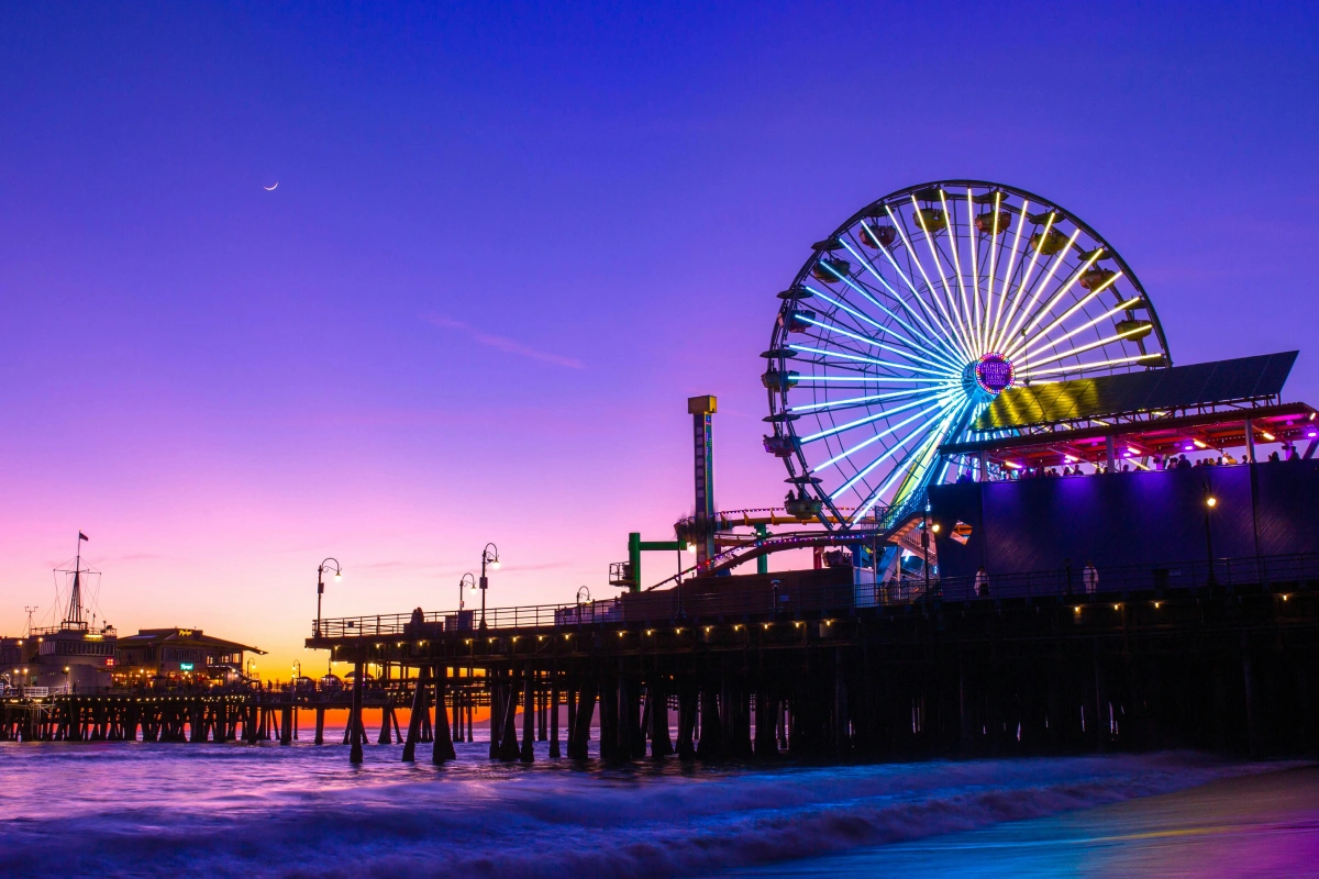 The Santa Monica Pier and it's Ferris Wheel lit up at night