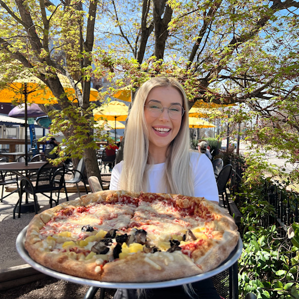 Noelle Foley with a pizza in Raleigh, NC