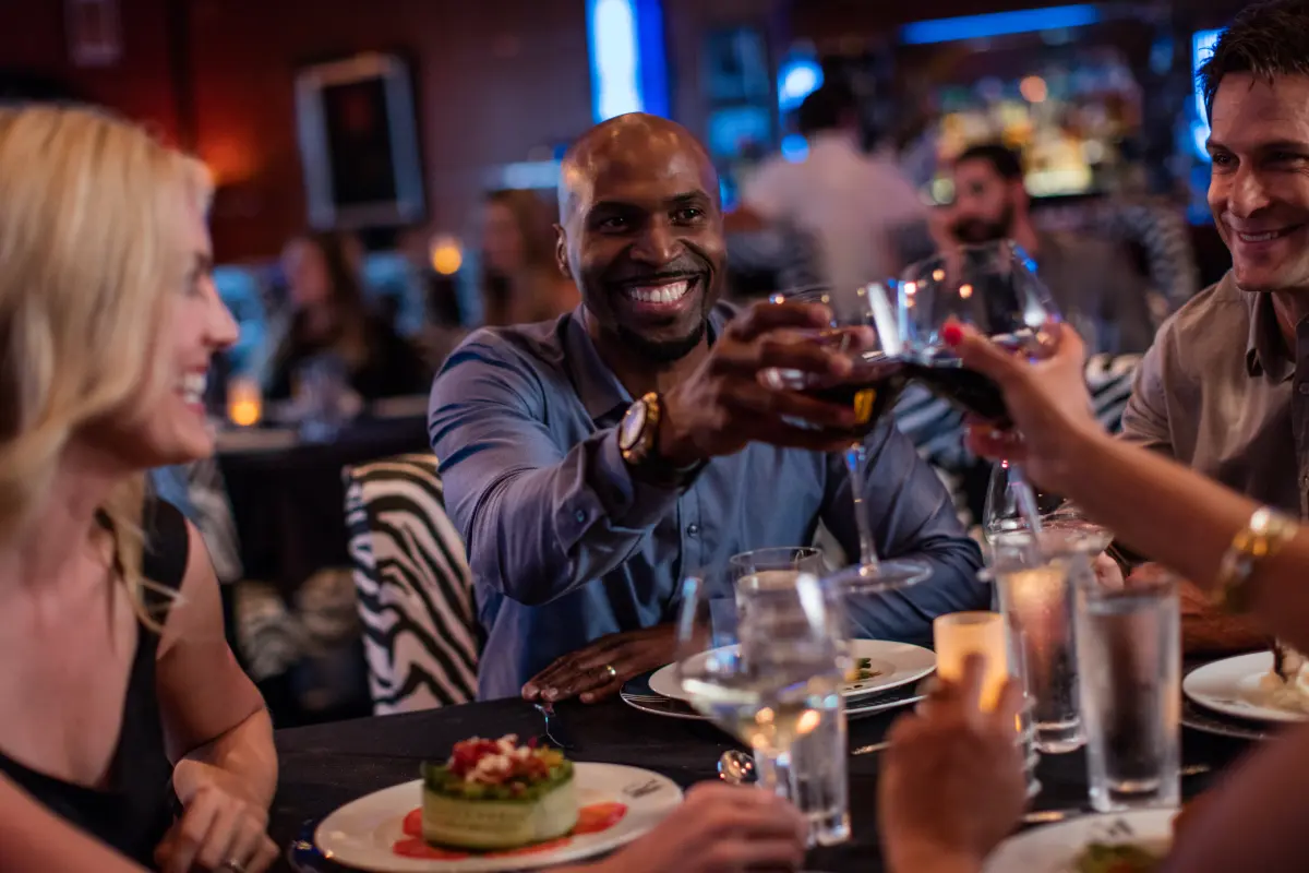 Friends toasting drinks in a nice restaurant
