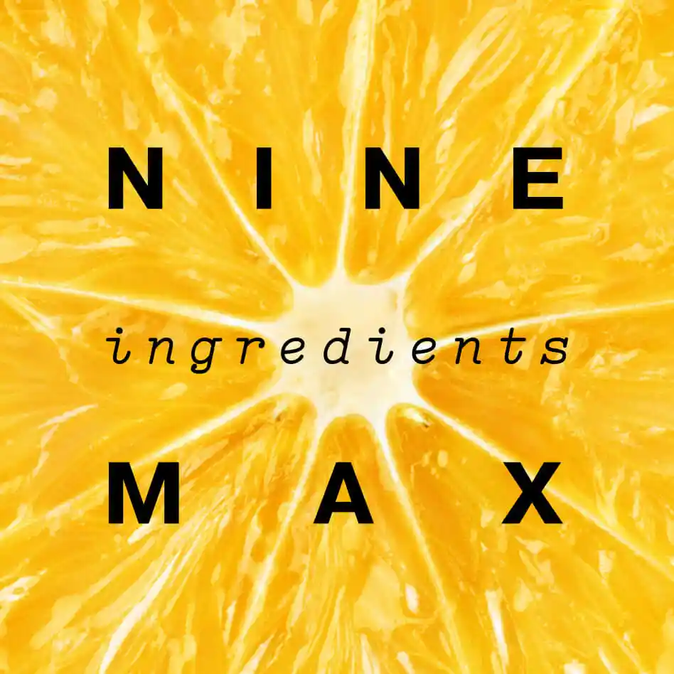 Macro shot of a citrus fruit with label: nine ingredients max