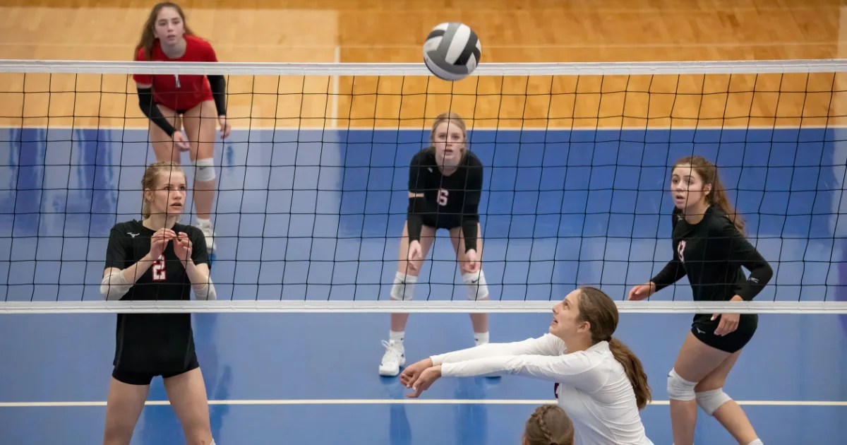A youth volleyball athlete on the court during a game