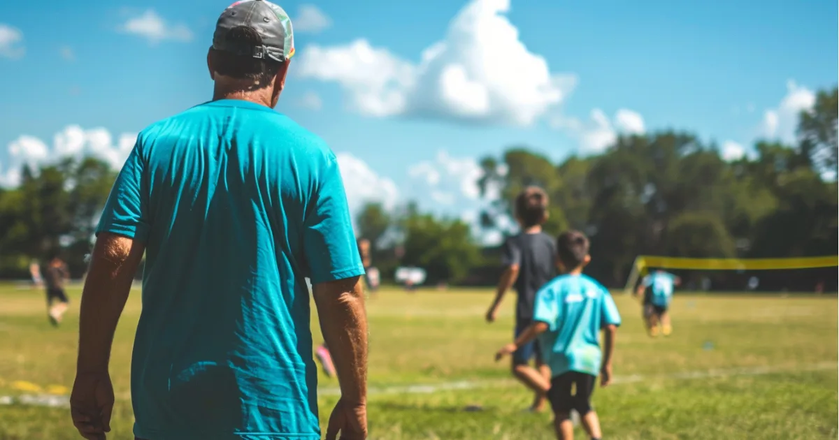 Youth sports coach training his athletes