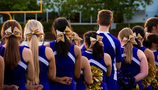 a new cheerleading team on the field at a game