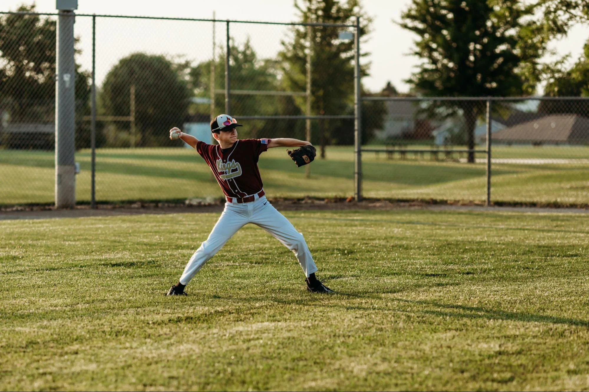 a baseball outfielder throwing a ball