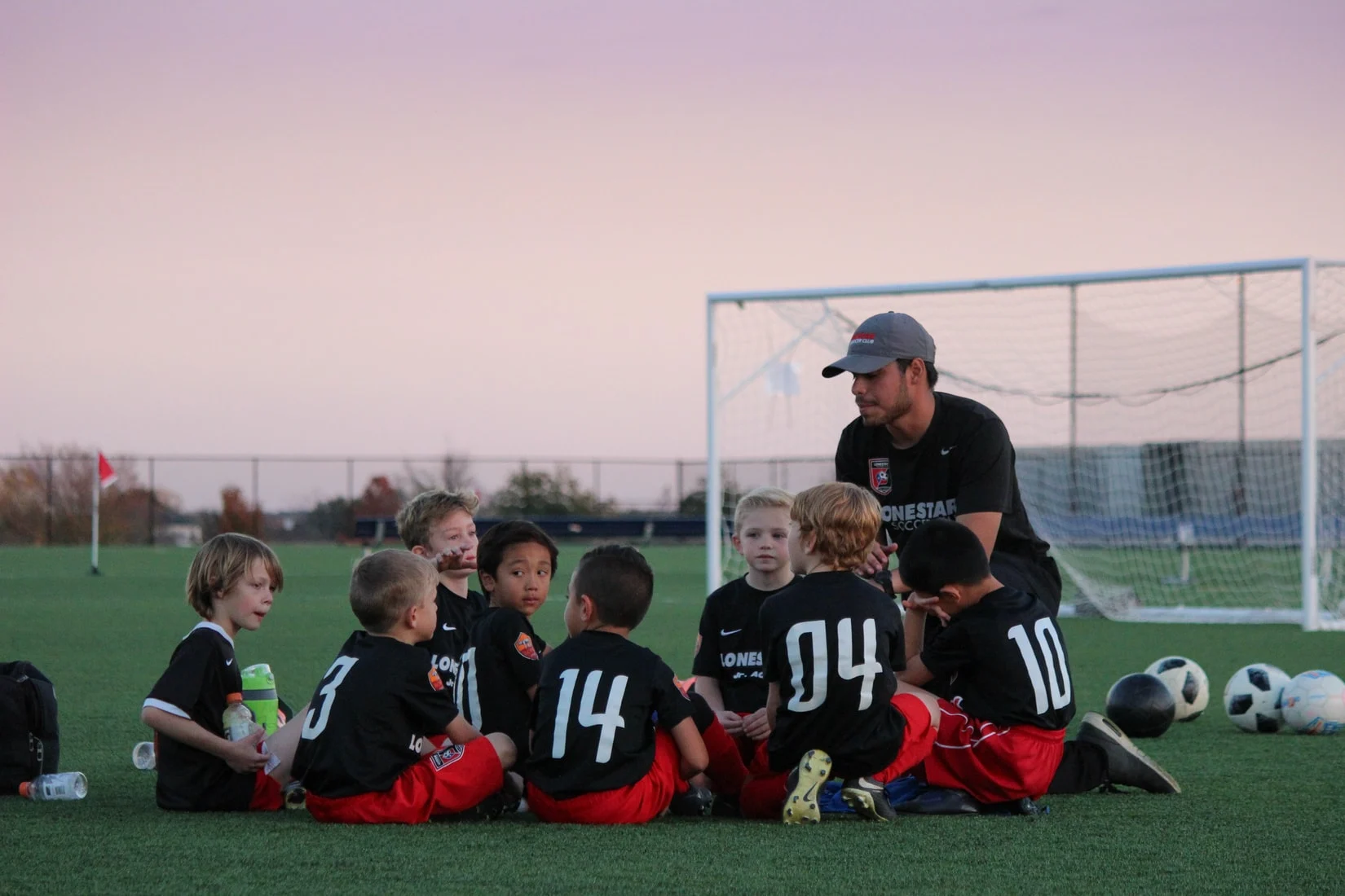 a soccer coach working with his players on team building