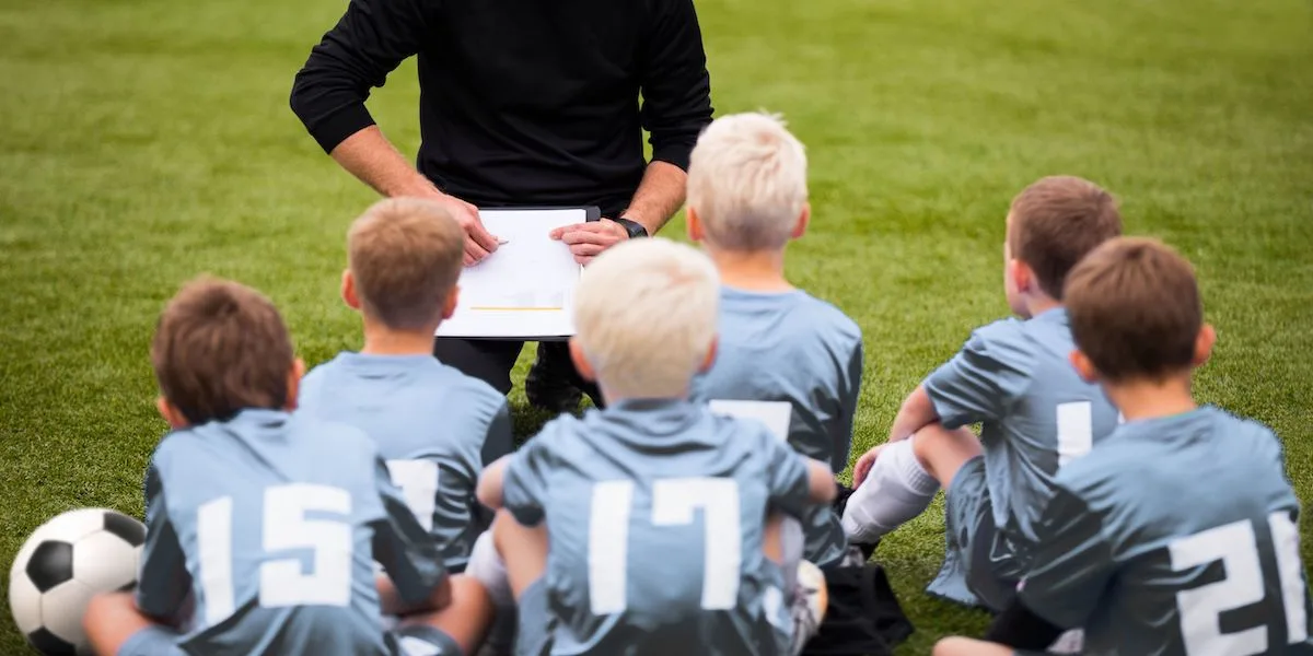 a youth soccer coach working with players