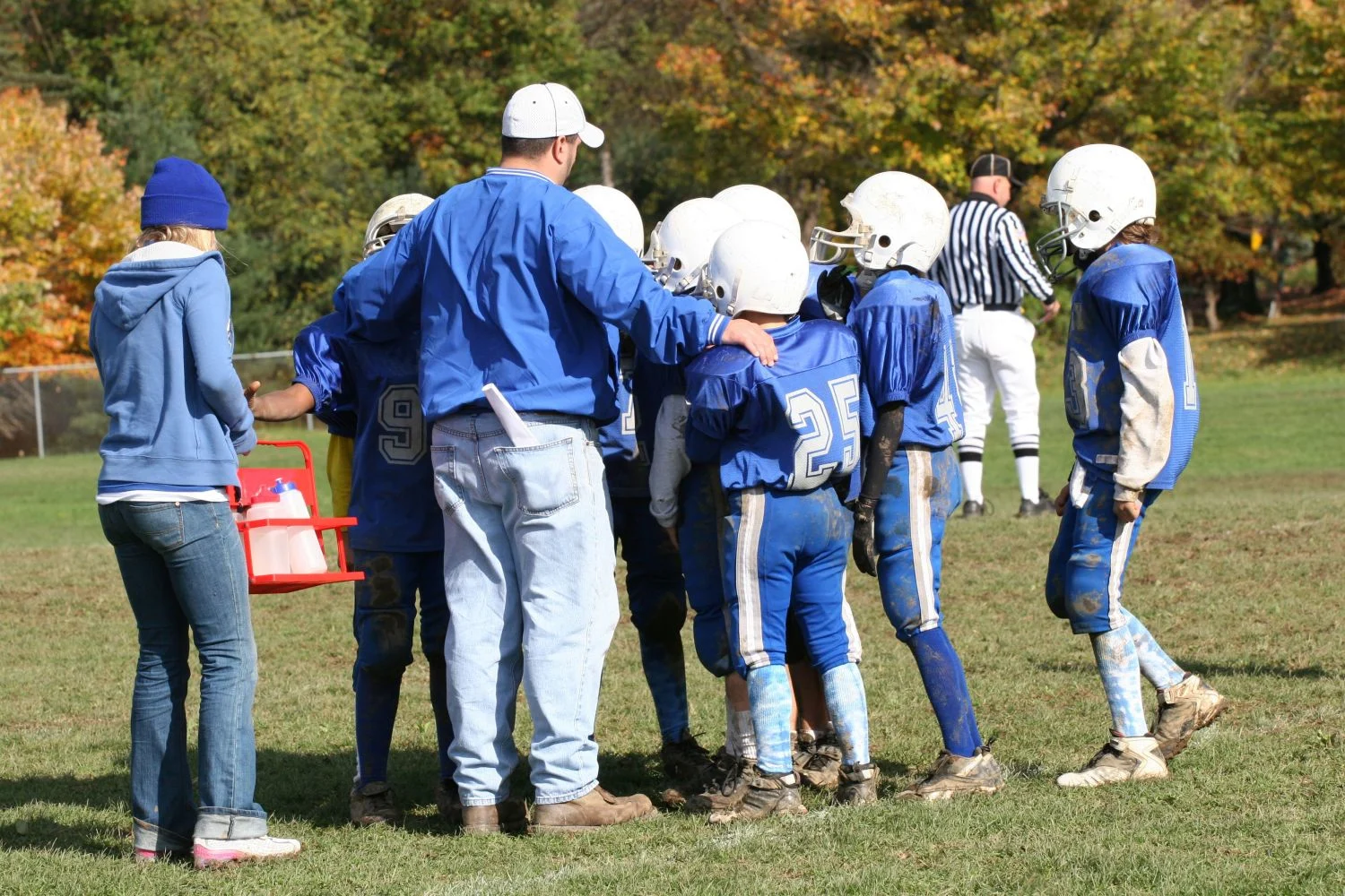 a coach with his youth football team