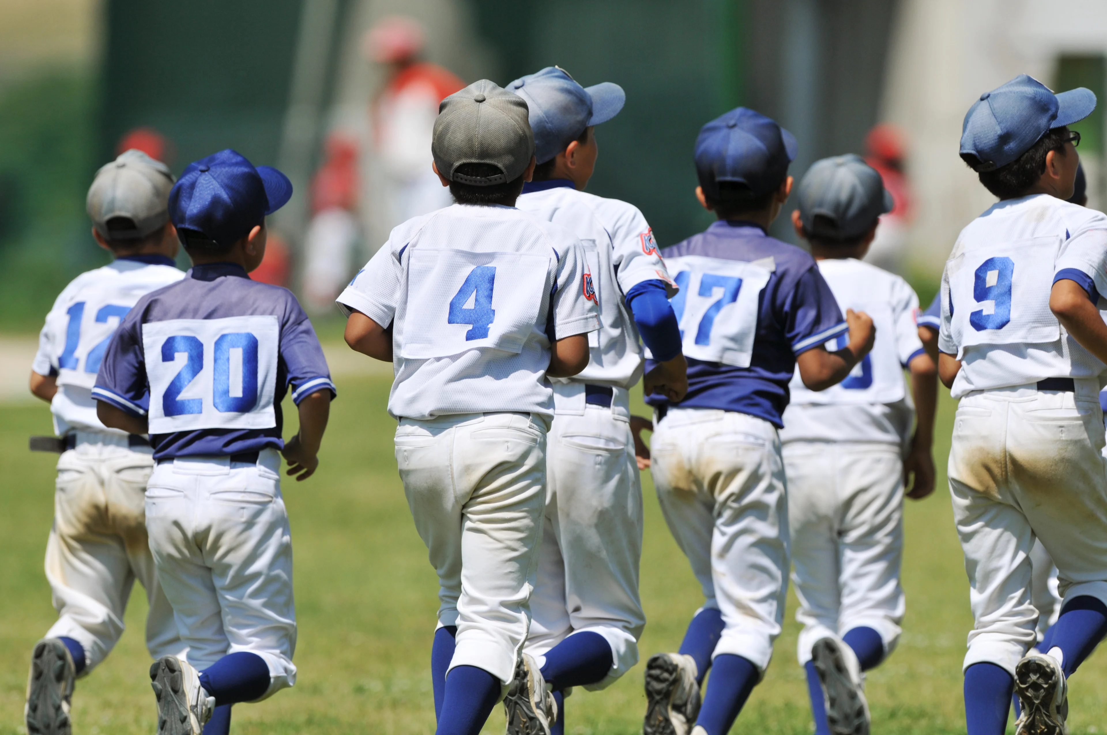 youth baseball players warming up before practice