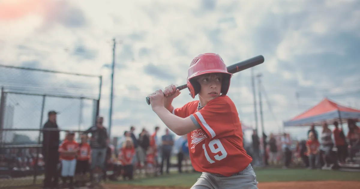A youth baseball player up to bat during a game