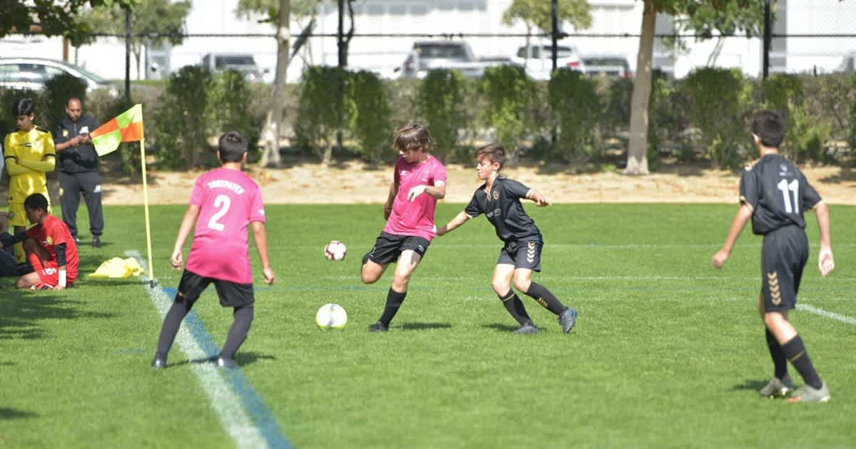 youth soccer player competing in a drill or scrimmage