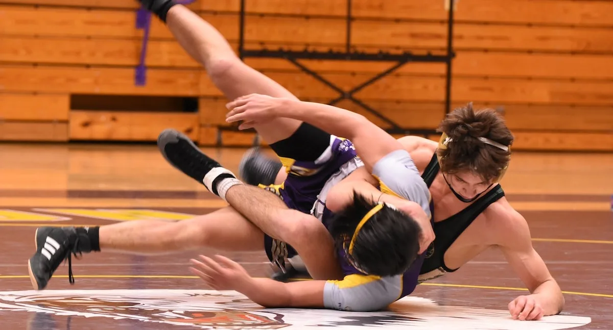 a youth wrestler trying to complete a takedown