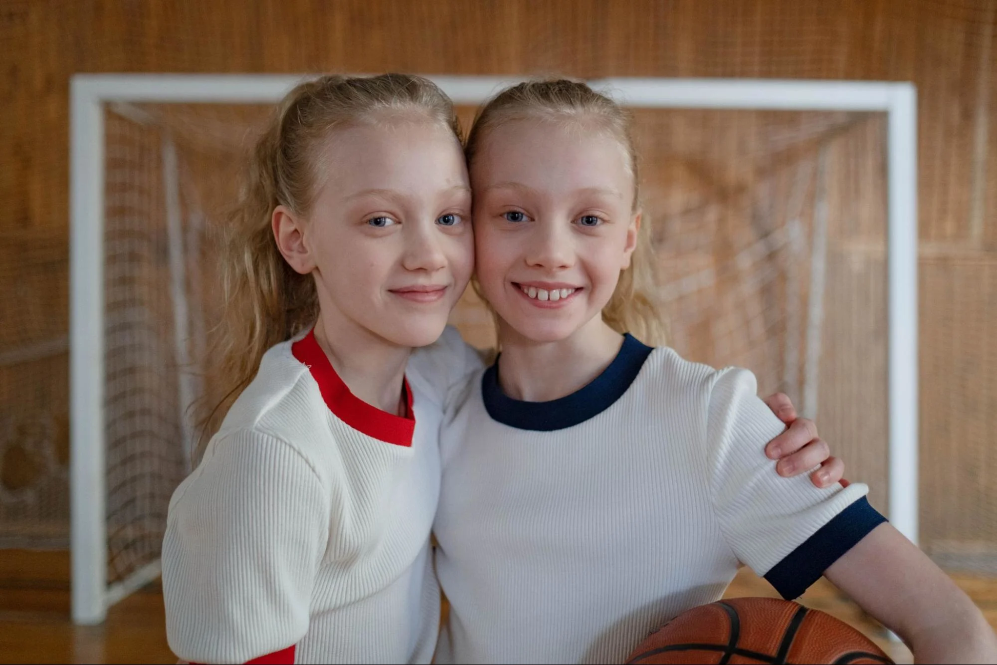 two youth basketball players making freinds