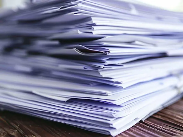 Stack of paper on a desk