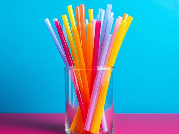 Jar of plastic straws in different colours