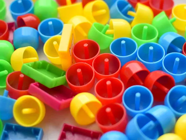 Various plastic toy pieces in primary colours