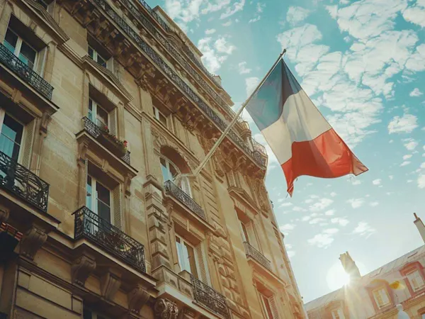 French flag flying outside a building