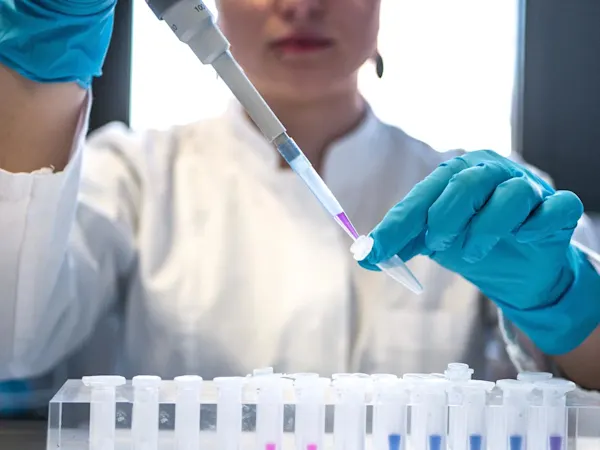 Scientist using a pipette