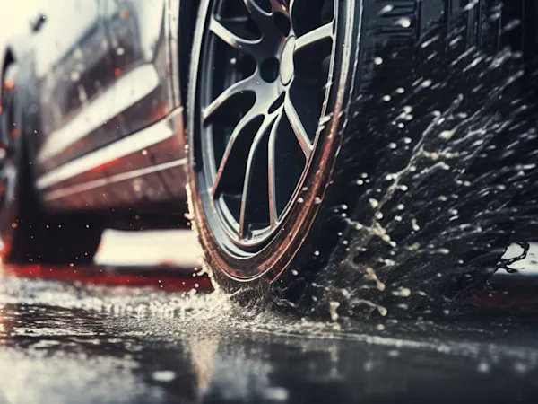 Car driving on a wet road