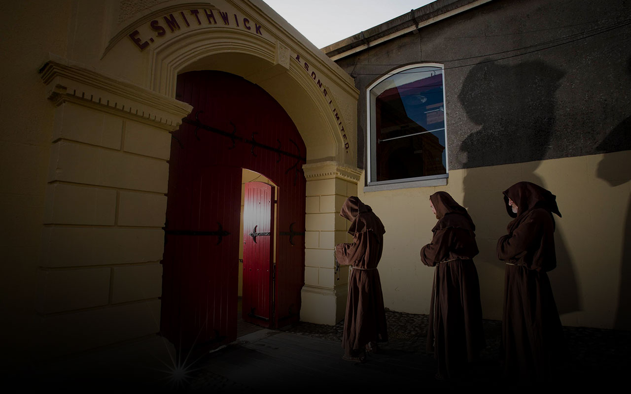 Three monks walking to Smithwick's Experience Kilkenny