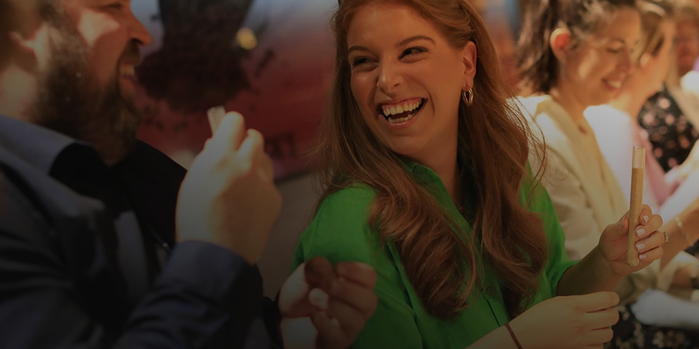 Two people smiling and looking at each other.