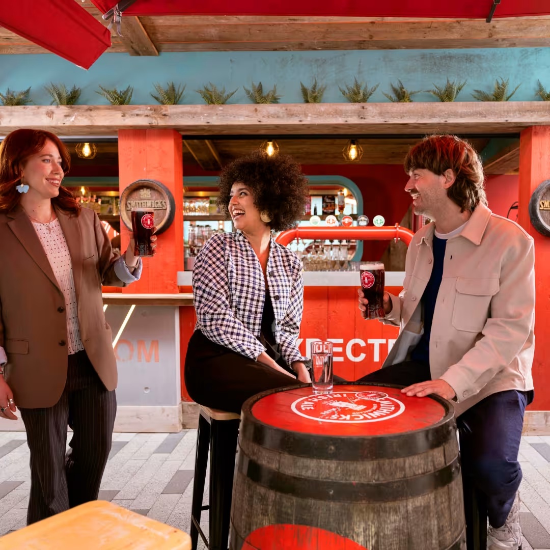 Three friends enjoying Smithwick's in the SEK Barrel yard