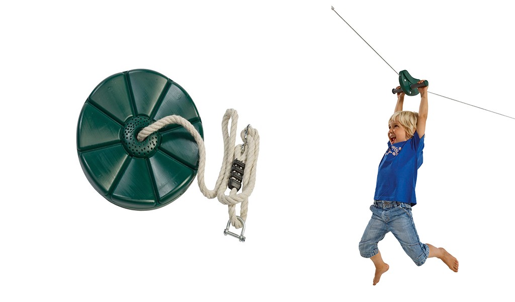 Grønn rund huskeplate med tau og feste, barn i blå t-skjorte svinger seg i taubane.