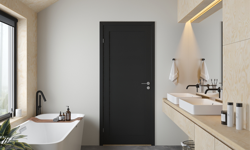 Sort massiv innerdør på lyst og moderne bad