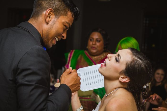 Aimee Ravichandran singing "Don't Stop Believing" to Josh Ravichandran at their wedding.