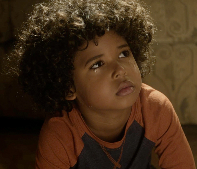 A child looking away from the camera.
