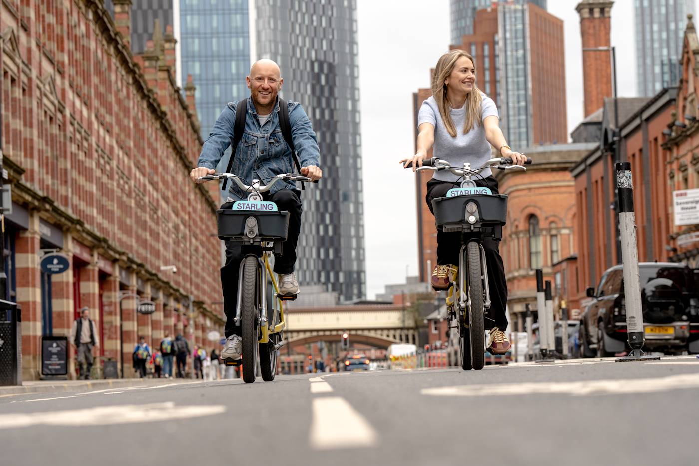 Two people riding starling bikes